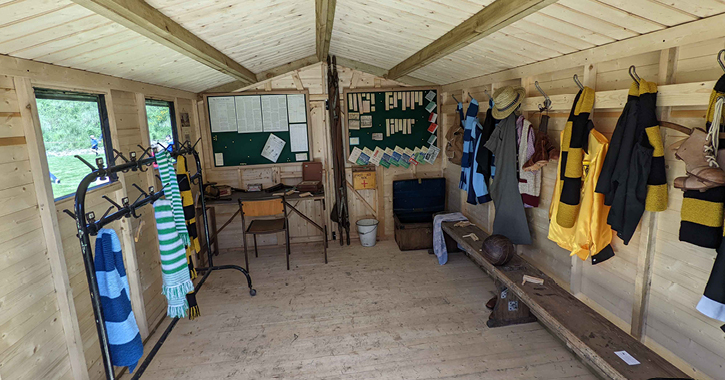 View inside 1950s recreation ground football changing room at Beamish Museum